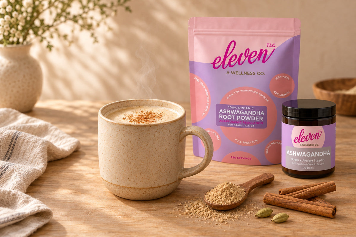 Warm ashwagandha moon milk with cinnamon beside Eleven TLC root powder jar and pouch