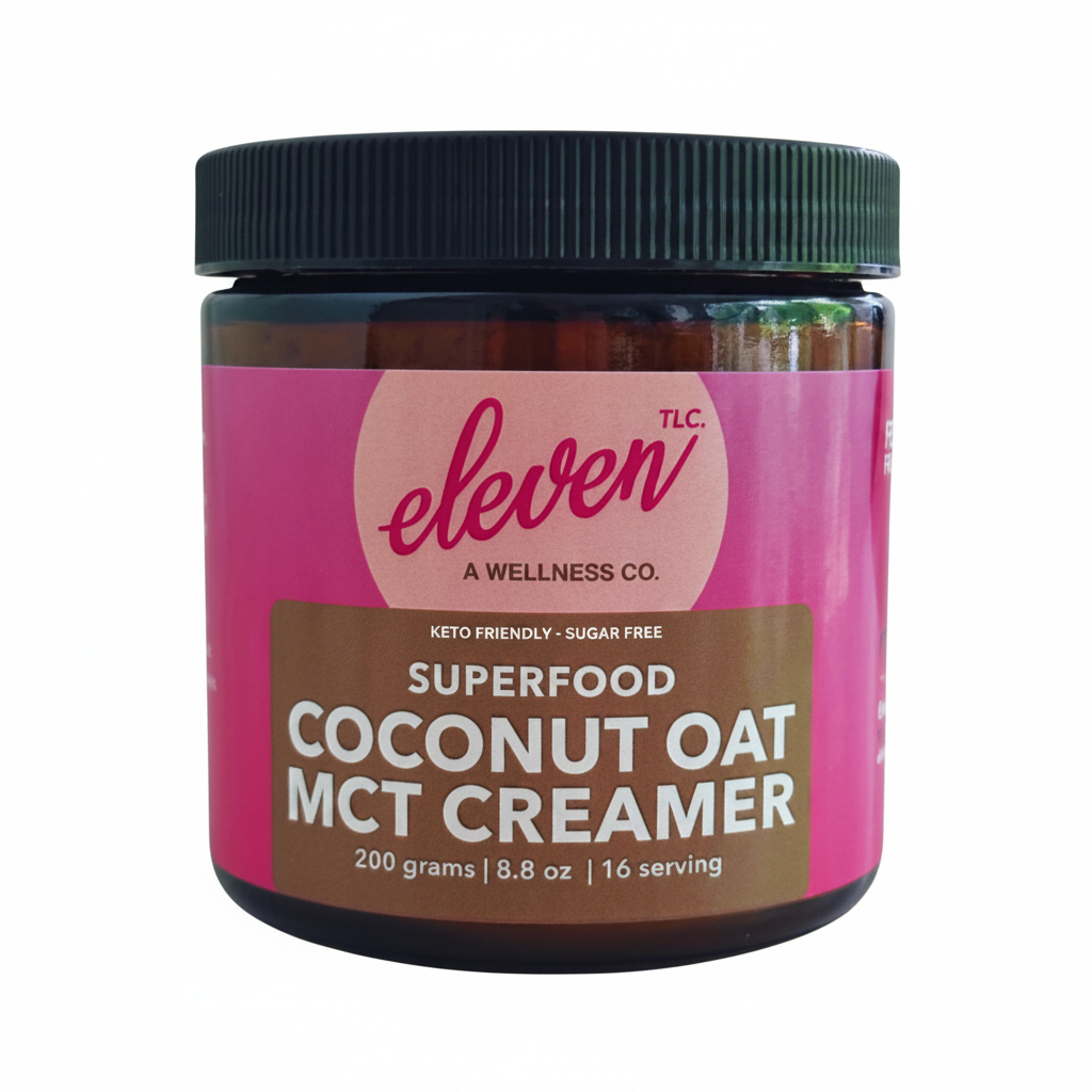 Amber glass jar of Eleven TLC coconut oat mct creamer, 500g label visible, white background, minimalist studio lighting, high-contrast typography, crisp focus on powder container base on limestone surface.
