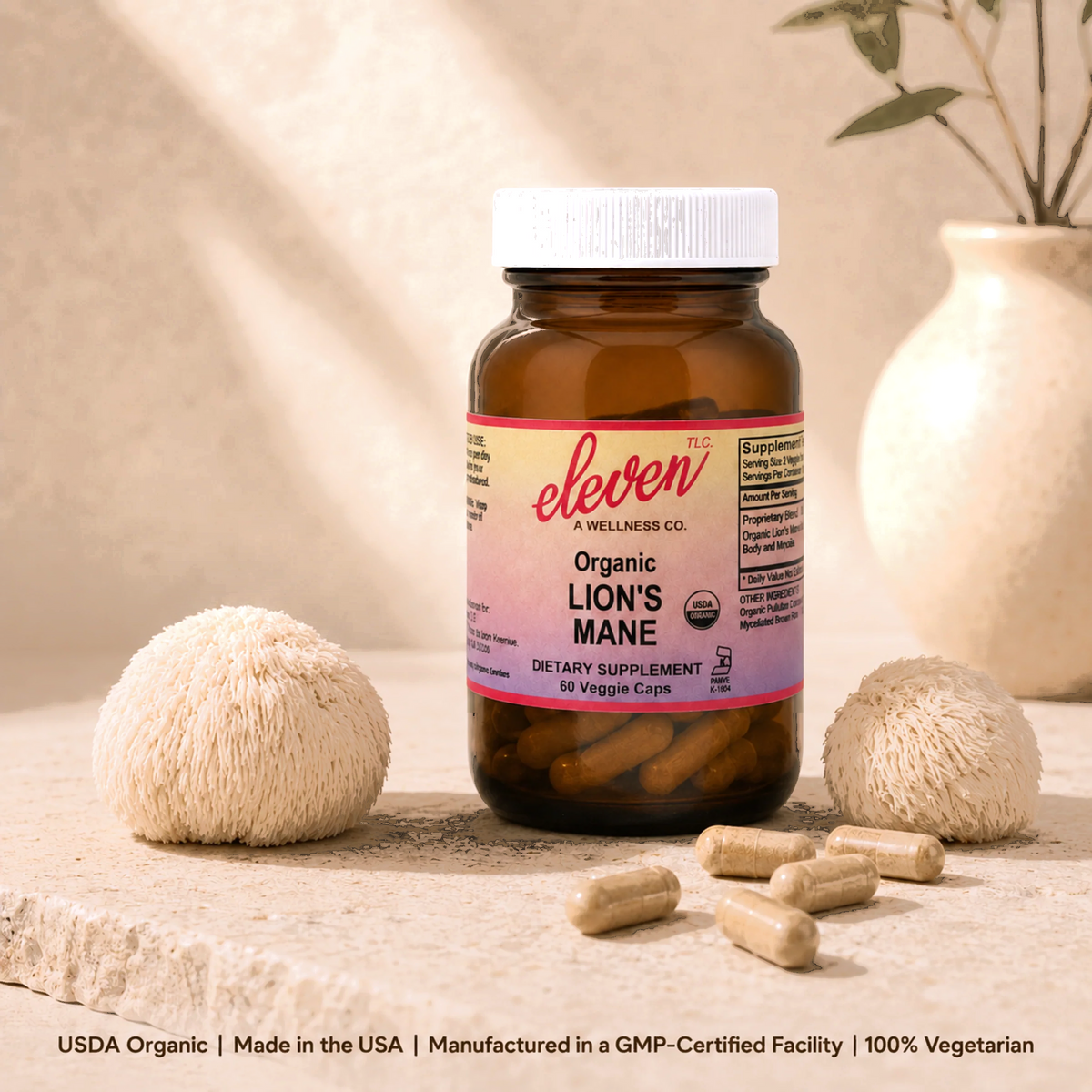 Eleven TLC 60-count Organic Lion's Mane mushroom capsules bottle displayed on neutral surface with dried mushroom specimens.