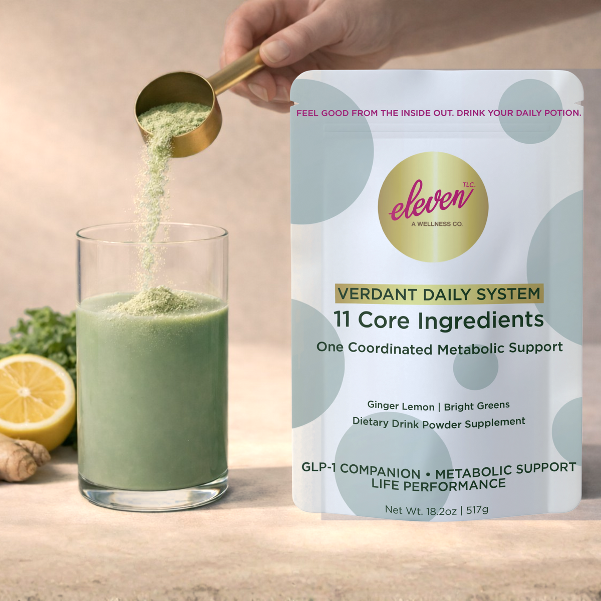 Scoop of Eleven TLC Verdant Daily System powder over a glass of green metabolic drink beside the pouch
