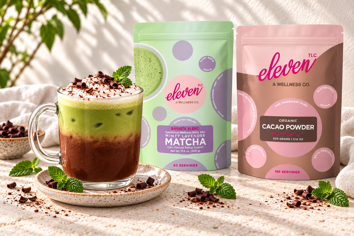 Chocolate mint matcha latte with cream and chocolate curls beside Eleven TLC Minty Lavender Matcha and Organic Cacao Powder 500g pouches.
