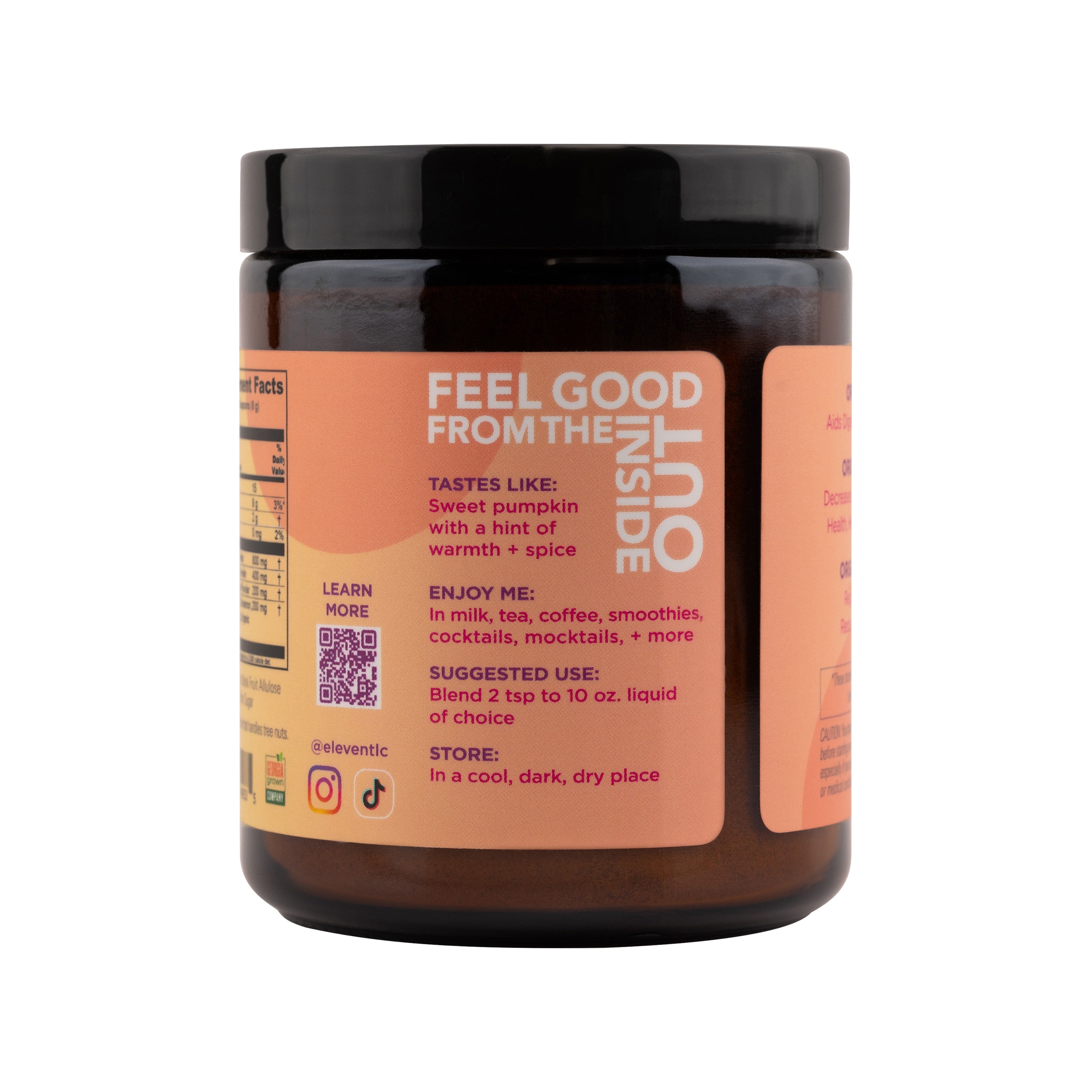 Back label of the Eleven TLC Organic Ginger Turmeric Drink Mix amber glass jar, featuring the header Feel Good From The Inside Out, daily usage instructions, and a scannable QR code.