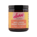 Eleven TLC UV-protective amber glass jar containing Organic Ginger Turmeric Golden Drink Mix powder for digestive support.