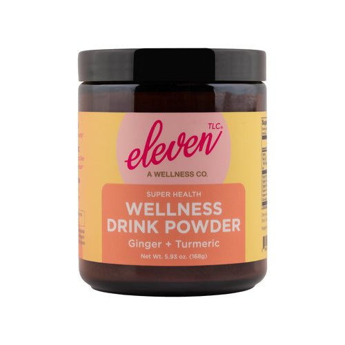 Eleven TLC UV-protective amber glass jar containing Organic Ginger Turmeric Golden Drink Mix powder for digestive support.