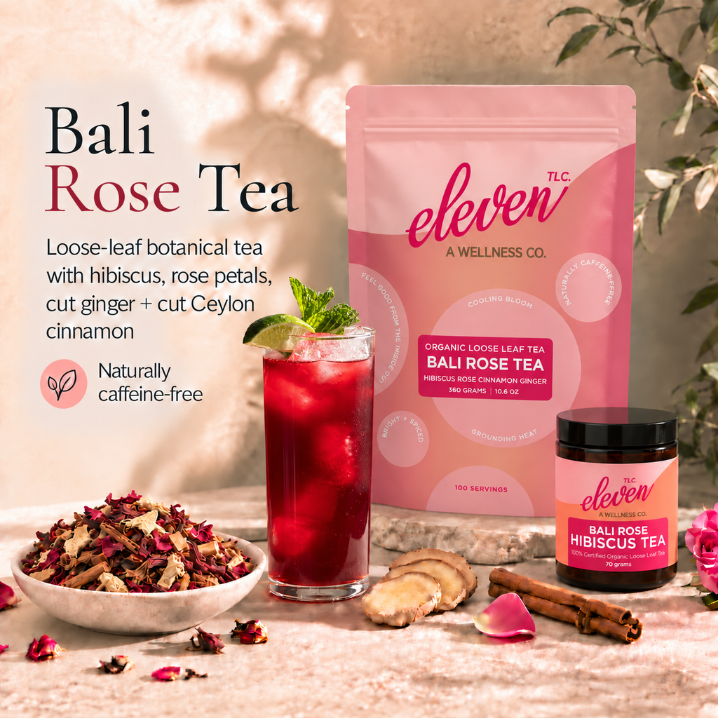 Eleven TLC Bali Rose Tea pouch and 70g jar beside ruby-red hibiscus iced tea with lime and mint and a bowl of loose-leaf tea on warm travertine.
