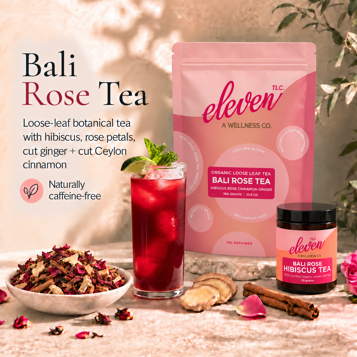 Eleven TLC Bali Rose Tea pouch and 70g jar beside ruby-red hibiscus iced tea with lime and mint and a bowl of loose-leaf tea on warm travertine.