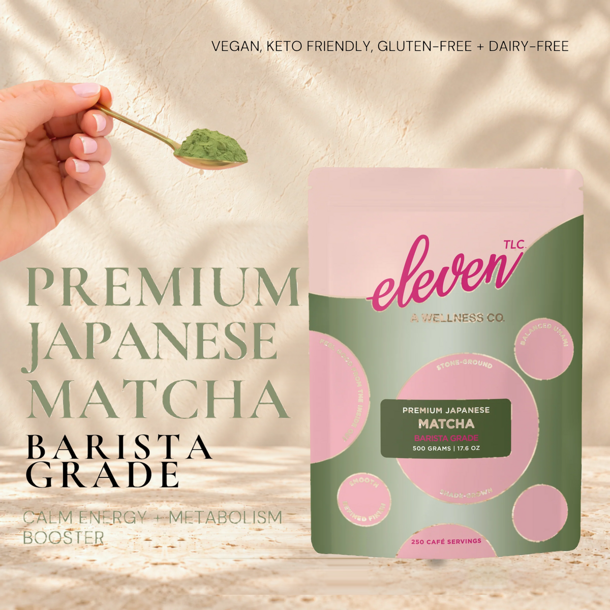Hand holding a spoon of matcha beside the Eleven TLC Organic Barista Matcha Powder 500g pouch; text reads Premium Japanese Matcha, Barista Grade, vegan, keto friendly, gluten-free and dairy-free.