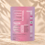 Back view of an Eleven TLC Coconut MCT Oat Creamer 500g pouch on warm travertine against a cream plaster wall with botanical shadows.
