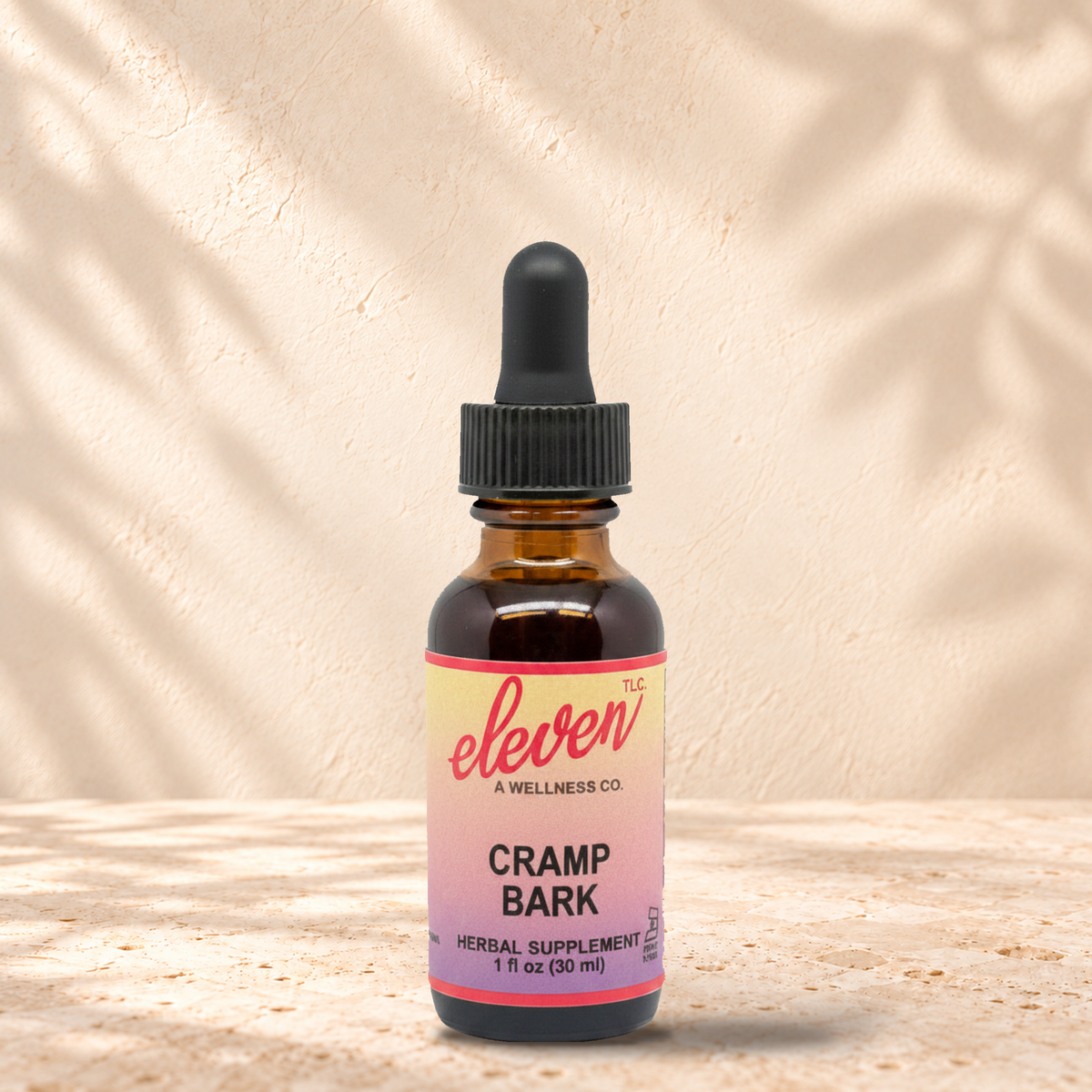 Eleven TLC Cramp Bark herbal tincture for menstrual comfort, 1 fl oz amber dropper bottle with pink and yellow label
