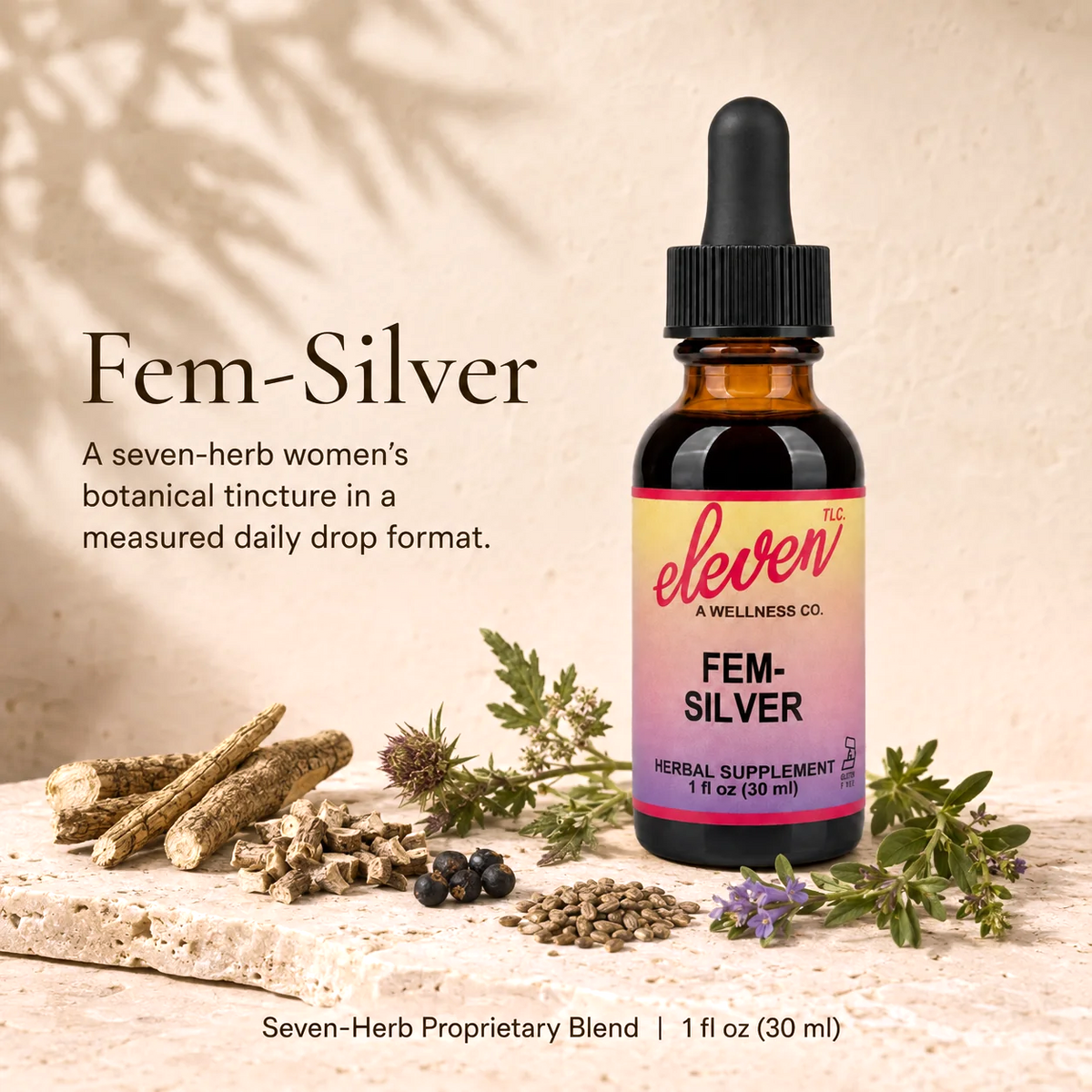 Eleven TLC Fem-Silver 1 oz tincture bottle, dropper cap, surrounded by botanical herbs on a wooden surface.