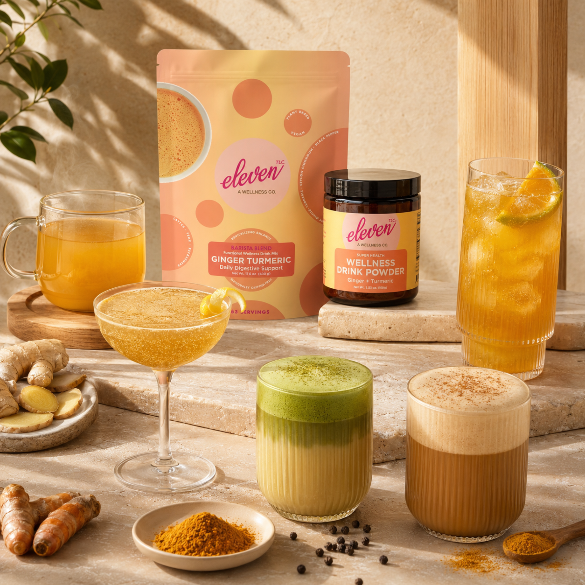 Eleven TLC Ginger Turmeric Barista Blend 500g pouch and jar, surrounded by raw ginger, whole turmeric, and five distinct prepared daily signal beverages: a hot golden latte, an iced matcha turmeric fusion, a tall iced citrus refresher, a hot clear tonic, and a cold coupe mocktail.