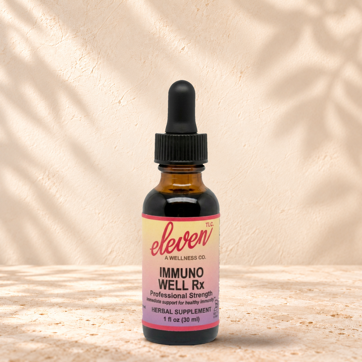 Eleven TLC Immuno-Well Rx herbal tincture for deep immune support, 1 fl oz amber dropper bottle with pink and yellow label
