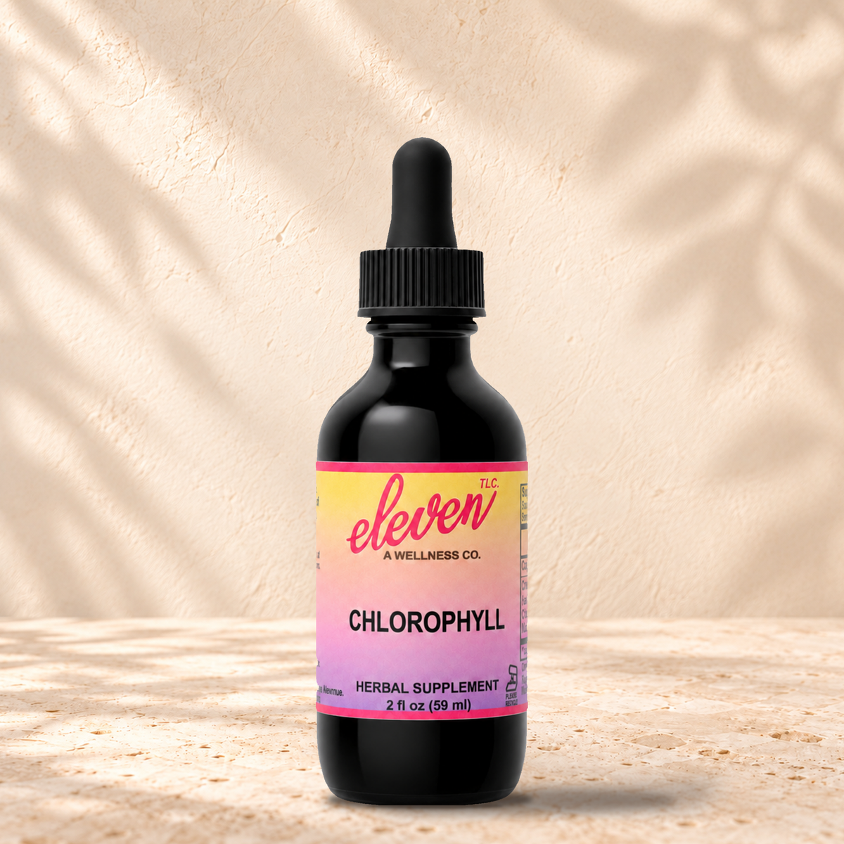Eleven TLC liquid chlorophyll alcohol-free herbal tincture, 2 fl oz black glass dropper bottle with pink and yellow label