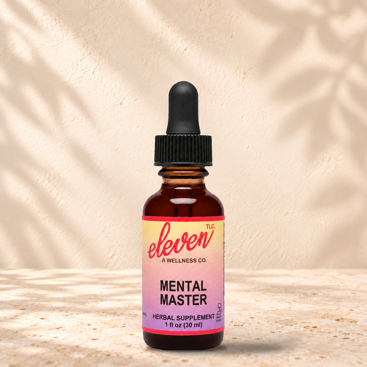 Eleven TLC Mental Master herbal tincture for focus and memory, 1 fl oz amber dropper bottle with pink and yellow label