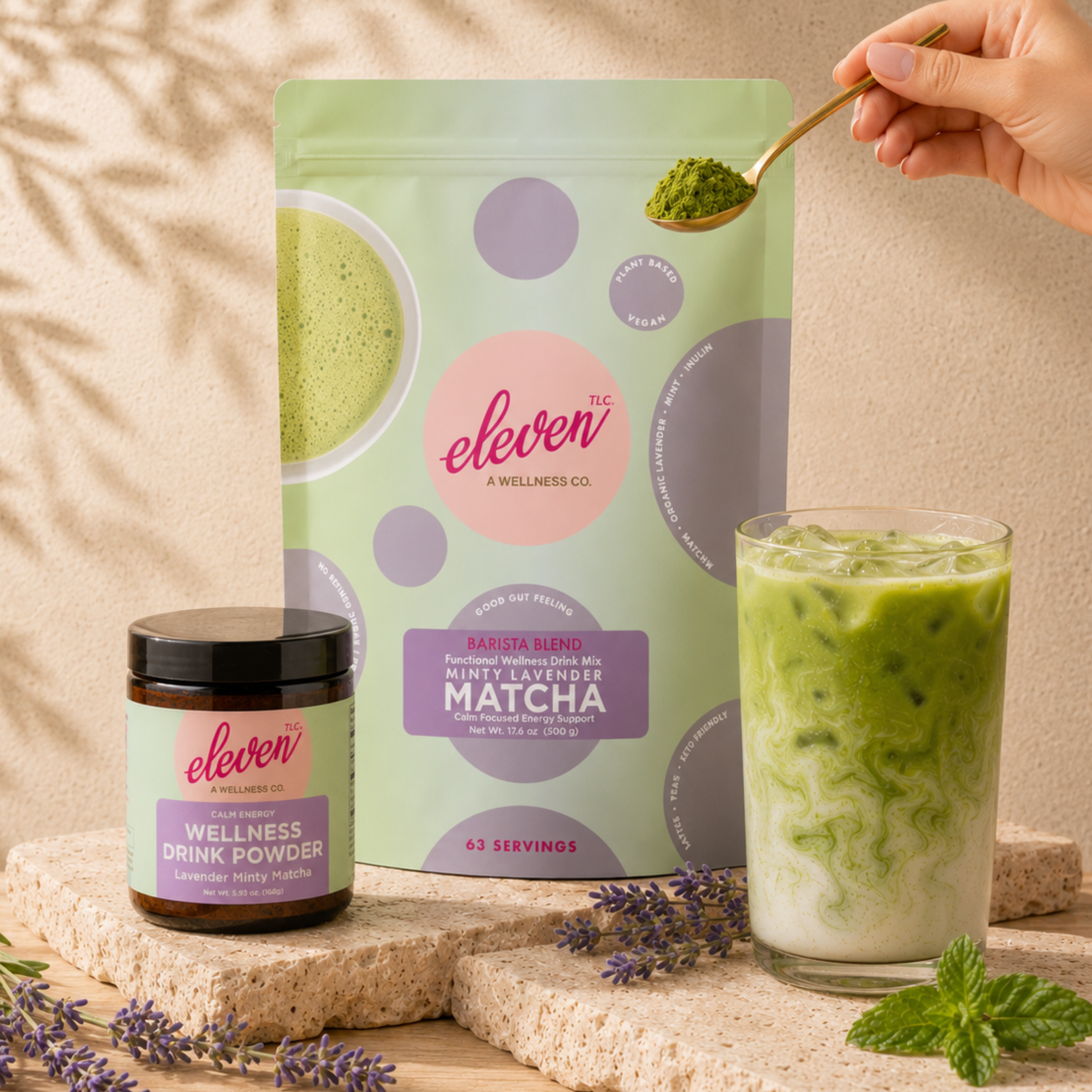 eleven-tlc-minty-lavender-matcha-powder-display-featuring-500g-bulk-pouch-and-168g-amber-glass-jar-on-travertine-stone-with-matcha-latte-daily-signal-preparation