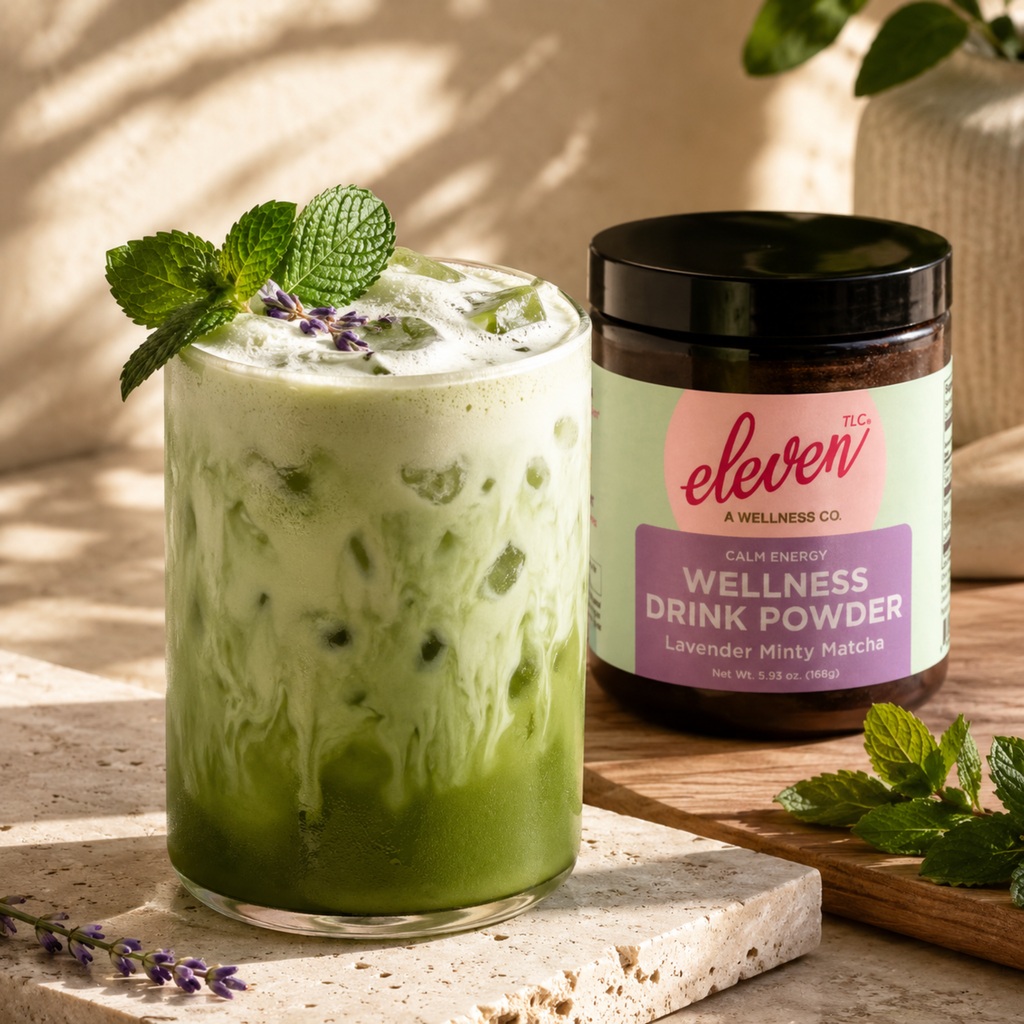 eleven-tlc-minty-lavender-matcha-powder-iced-latte-with-mint-garnish-and-168g-amber-glass-jar-on-travertine-stone-for-daily-signal