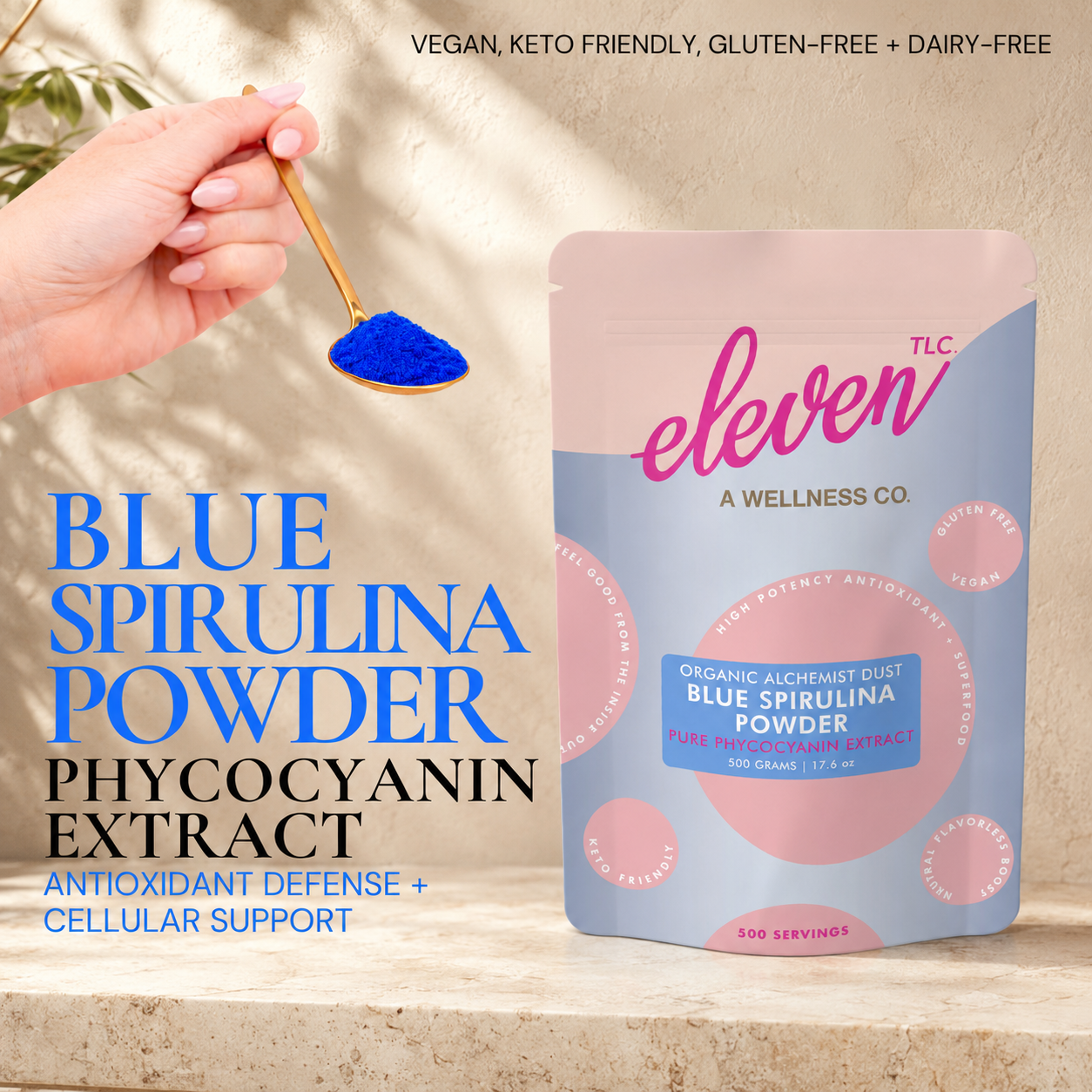 Eleven TLC organic blue spirulina powder pouch and gold spoon on marble surface with text overlay