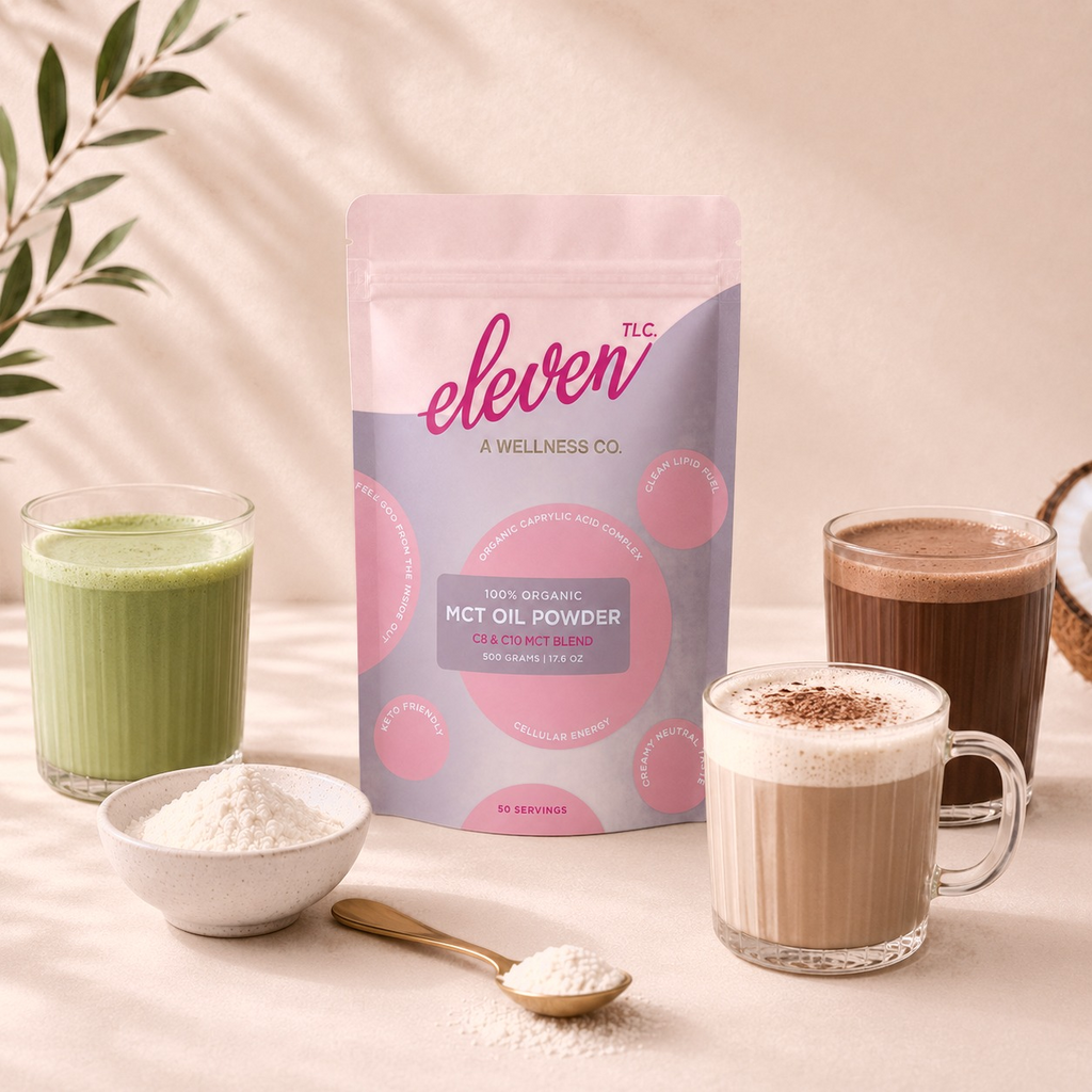 Eleven TLC organic MCT oil powder 500g pouch with a green matcha latte, a cappuccino, a mocha, a bowl and gold spoon of white powder and a coconut in warm window light.
