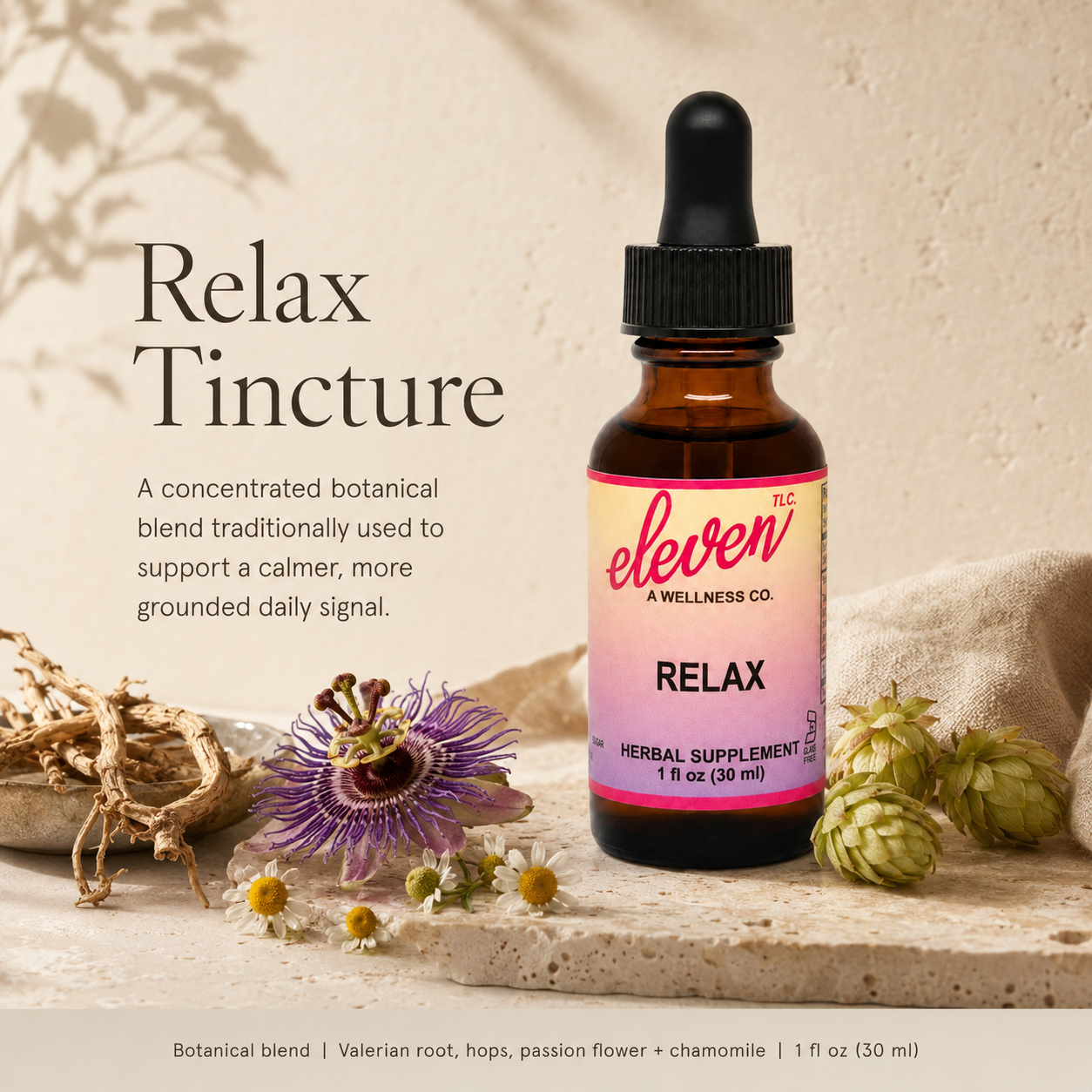 Eleven TLC Relax 1oz herbal tincture bottle with dropper, passion flowers, and chamomile on a neutral stone background.