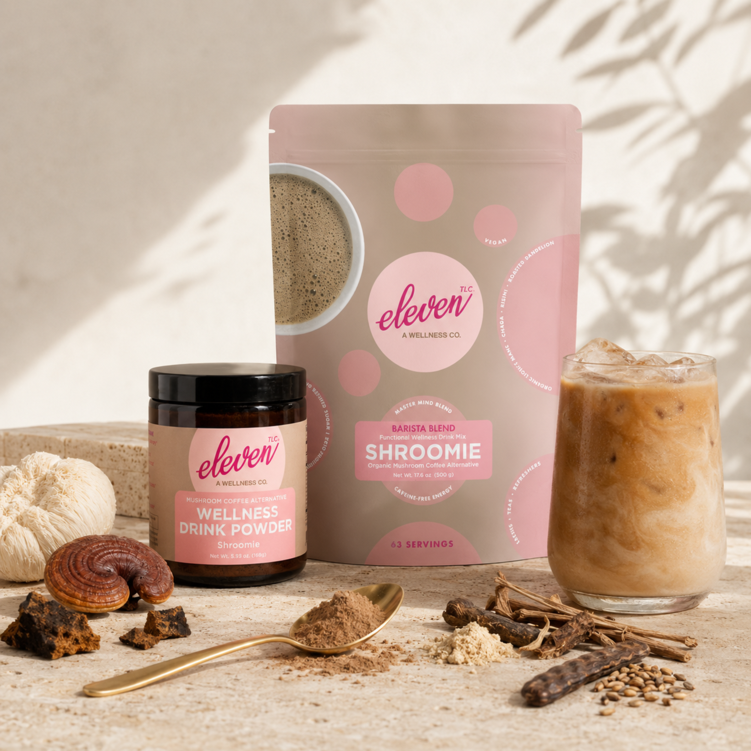 Eleven TLC Shroomie 500g bulk pouch with retail jar, wooden scoop, and prepared adaptogen latte on neutral studio surface.