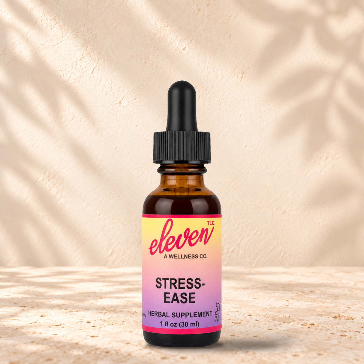 Eleven TLC Stress-Ease adaptogenic herbal tincture for calm, 1 fl oz amber dropper bottle with pink and yellow label