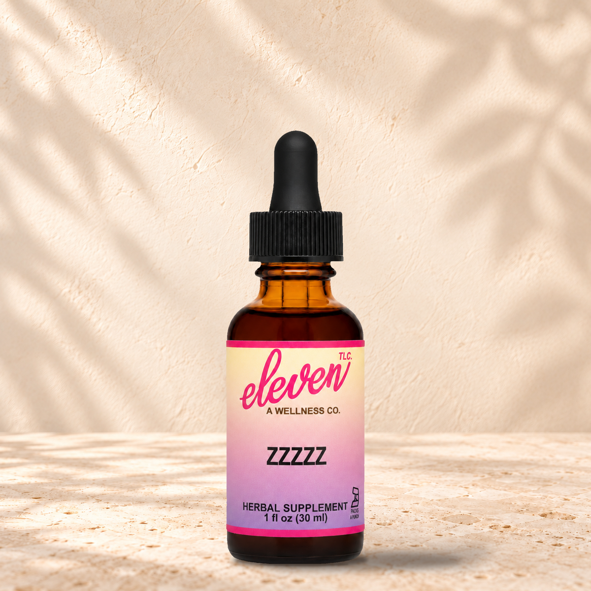 Eleven TLC ZZZZZ melatonin-free herbal sleep tincture, 1 fl oz amber dropper bottle with pink and yellow label