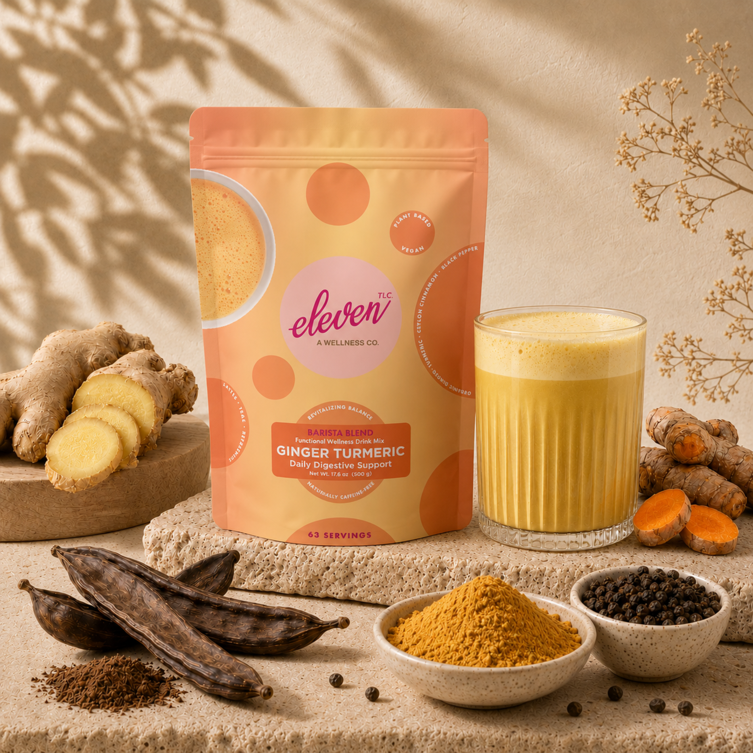 Bulk 500g pouch of Eleven TLC organic golden milk latte base and a prepared daily signal beverage, staged with raw ginger, turmeric roots, and carob pods against a warm, natural background